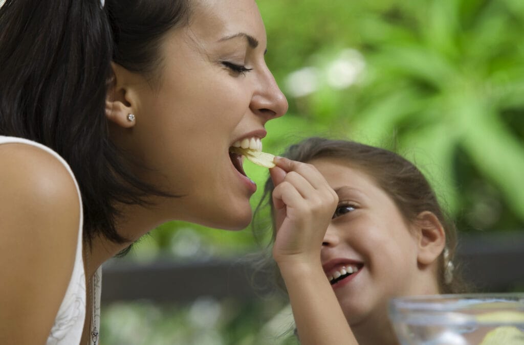 portrait of young woman having good time with her daughter
